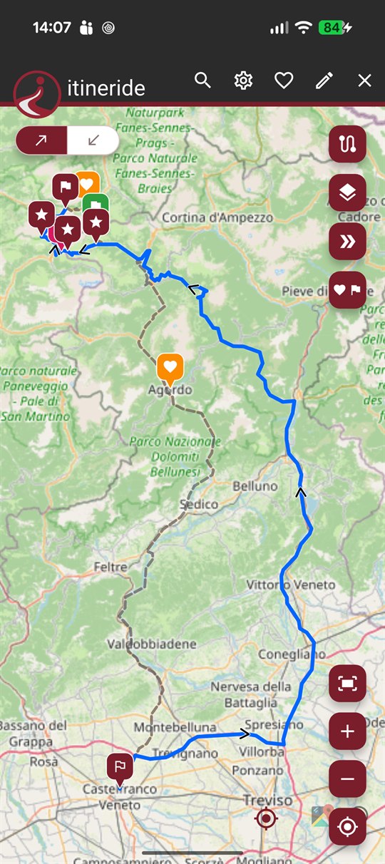 itineride on a phone: a route through the Dolomites drawn on the map, with stops and points of interest pinned along it.